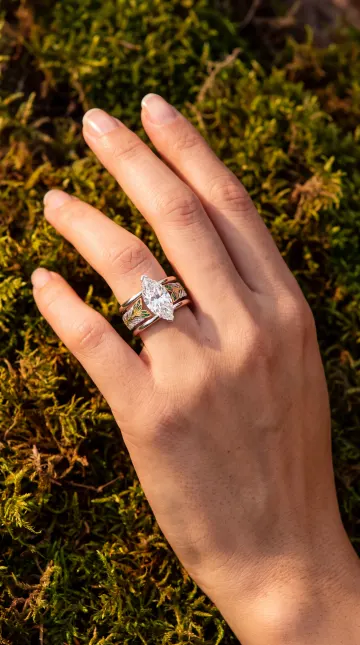 The ring worn on a hand, shot on moss
